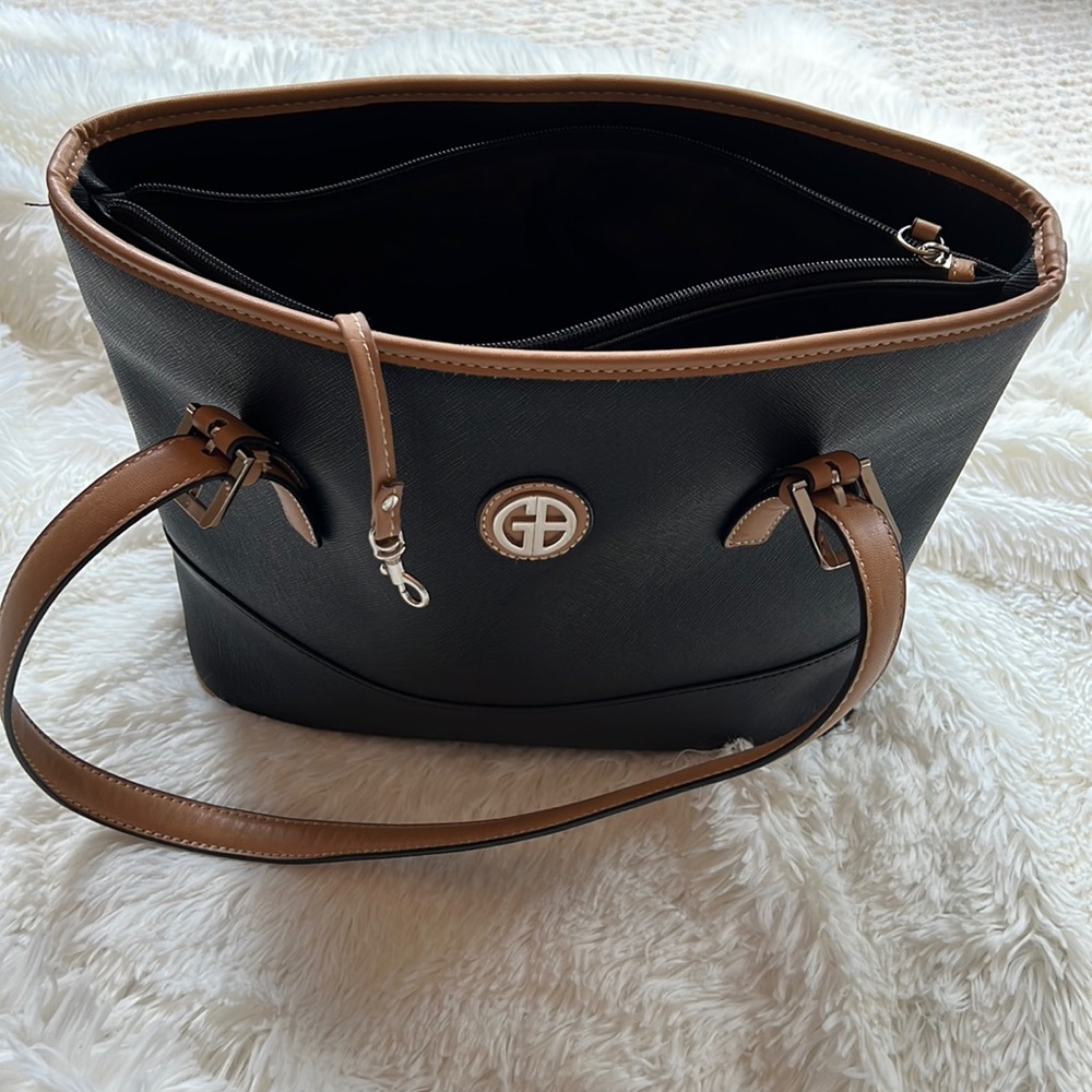 Black with tan handles and trim Giani Bernini Saffiano faux leather handbag.